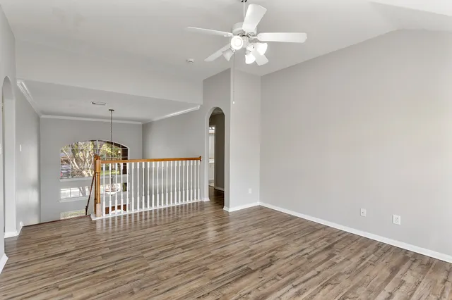 a view of a livingroom with wooden floor