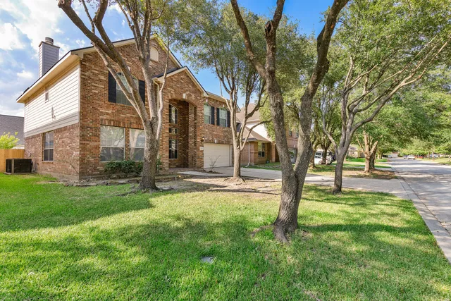 a backyard of a house with lots of green space