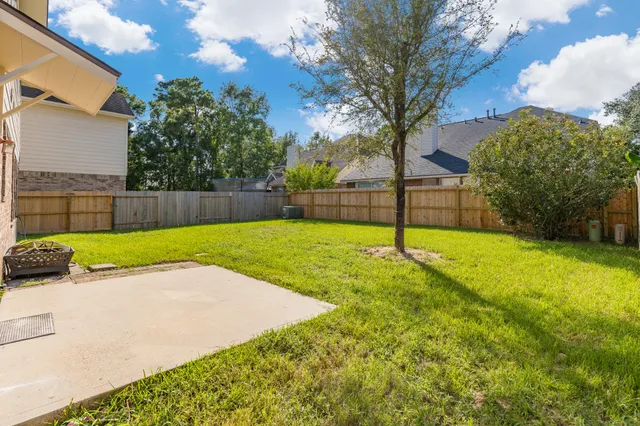 a view of backyard with green space