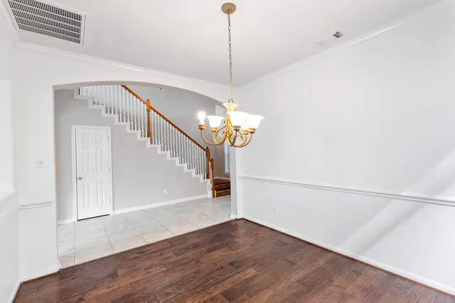 a view of a dining room with wooden floor