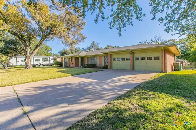 a view of house with yard
