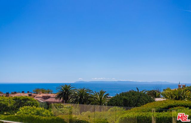 a large kitchen with a table and chairs
