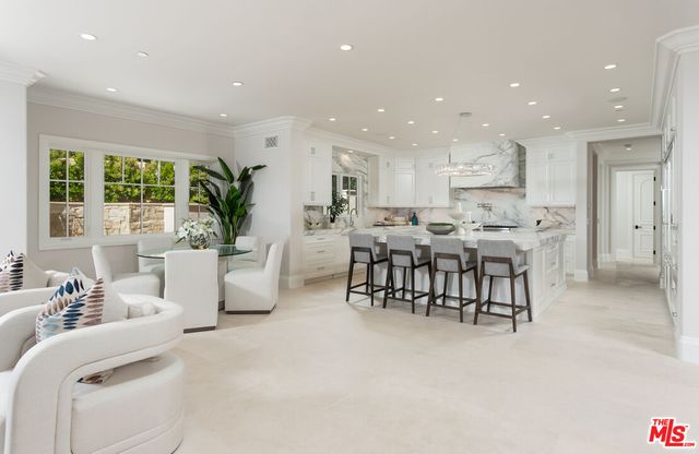 a kitchen with a stove and a white cabinets