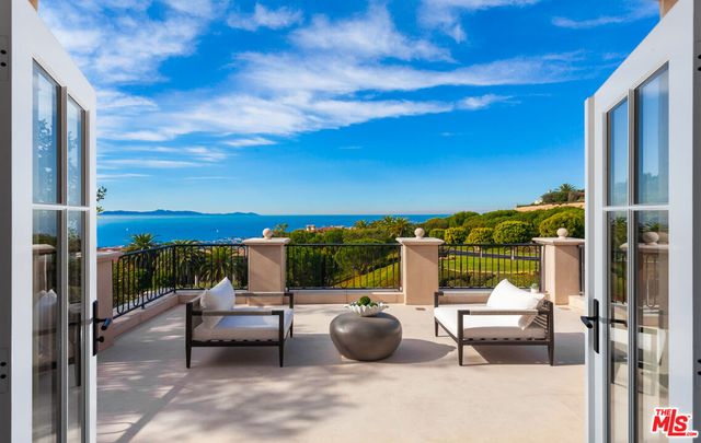 a view of a roof deck with couches