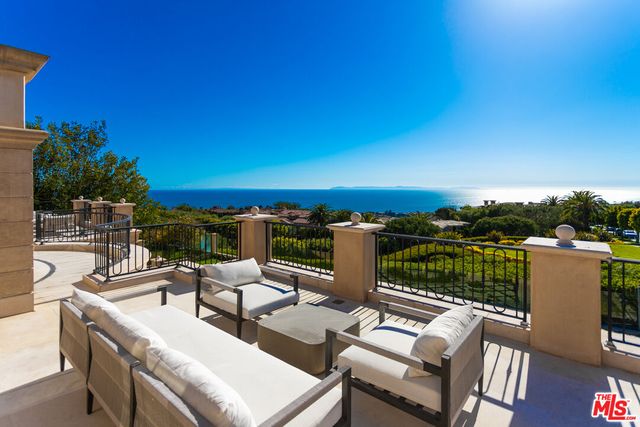 a spacious bathroom with a granite countertop sink mirror and vanity