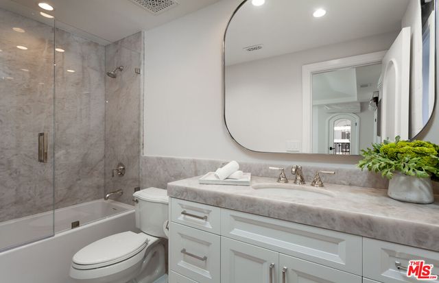 a swimming pool with outdoor seating