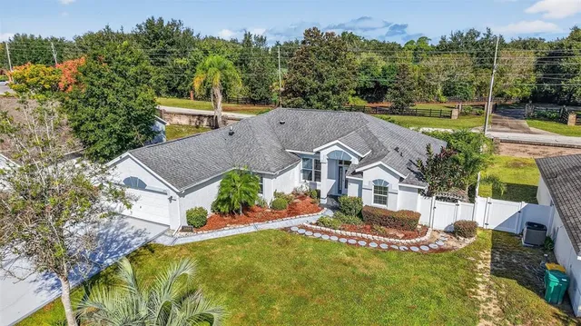 an aerial view of a house with a ocean view
