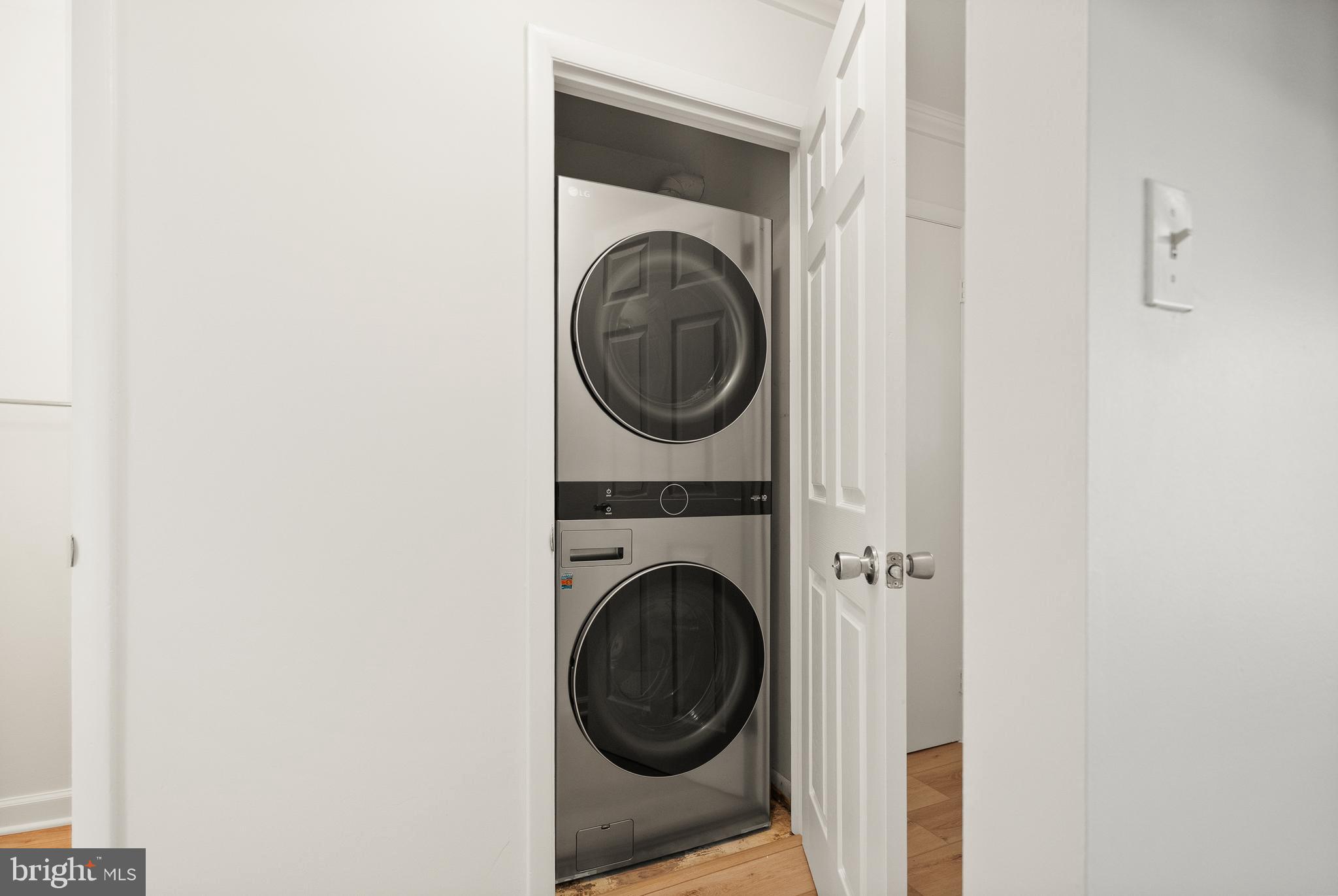 15278 Cloverdale Road Woodbridge, VA 22193 - Photo 26 of 35 a view of a hallway with washer and dryer