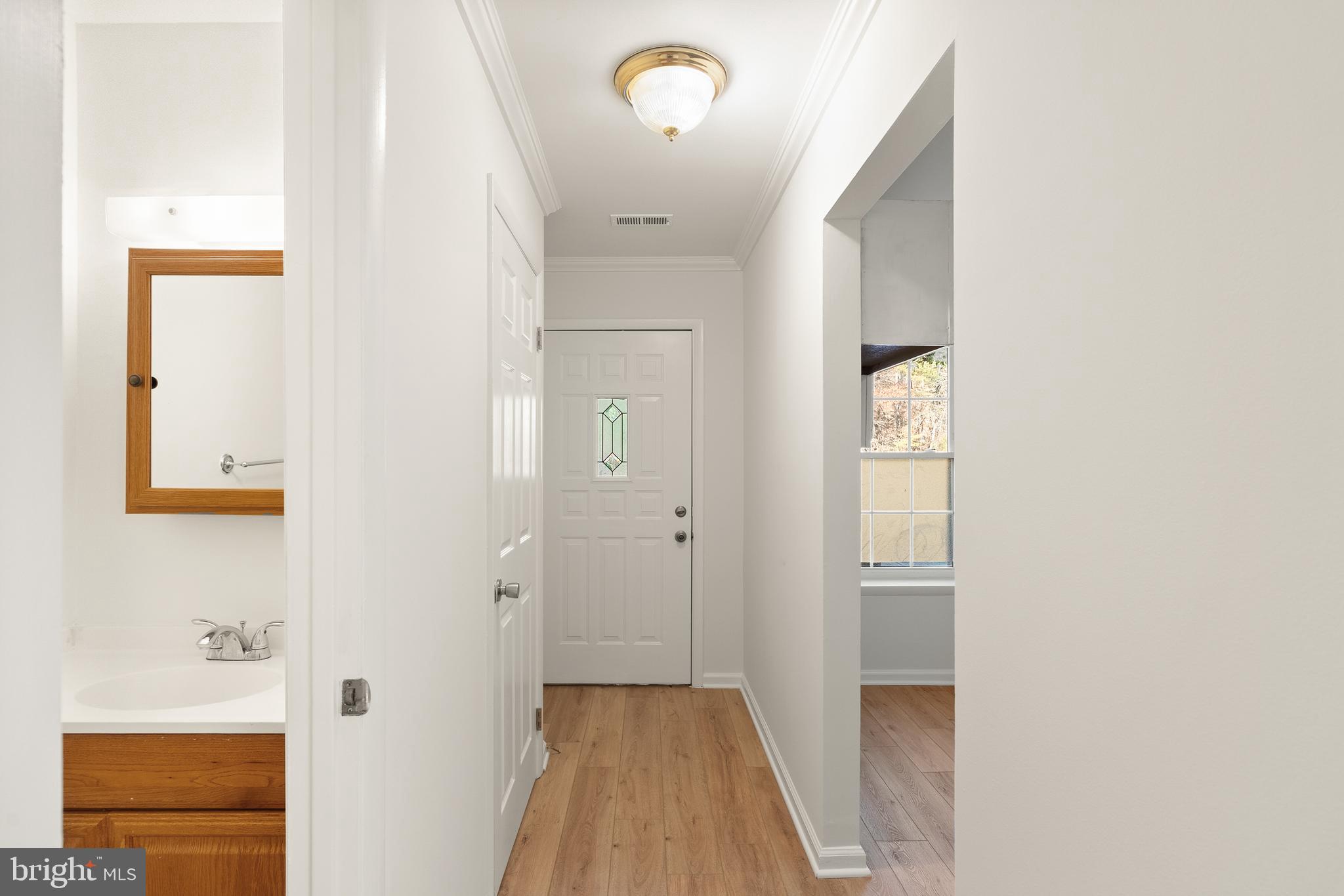 15278 Cloverdale Road Woodbridge, VA 22193 - Photo 3 of 35 a view of a hallway with wooden floor