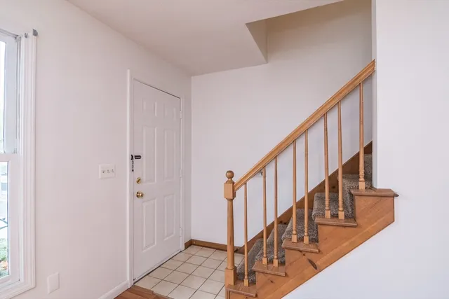 a view of an entryway with wooden floor
