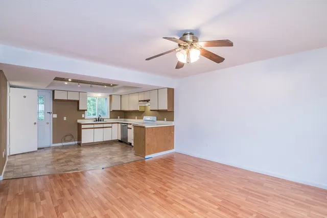 a view of kitchen with wooden floor