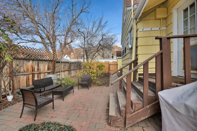 a hallway with sliding door and front door
