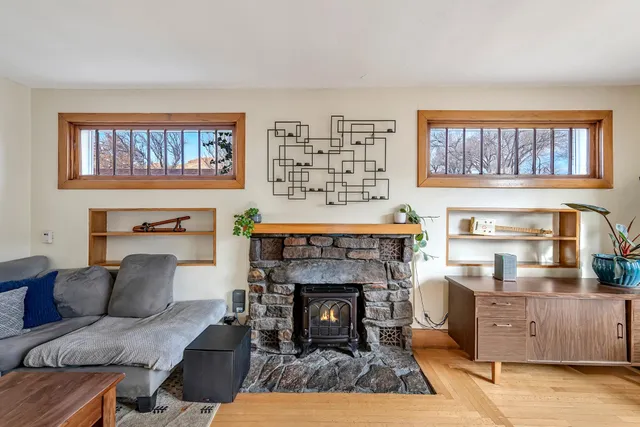 a kitchen with granite countertop a sink a counter top space stainless steel appliances and cabinets