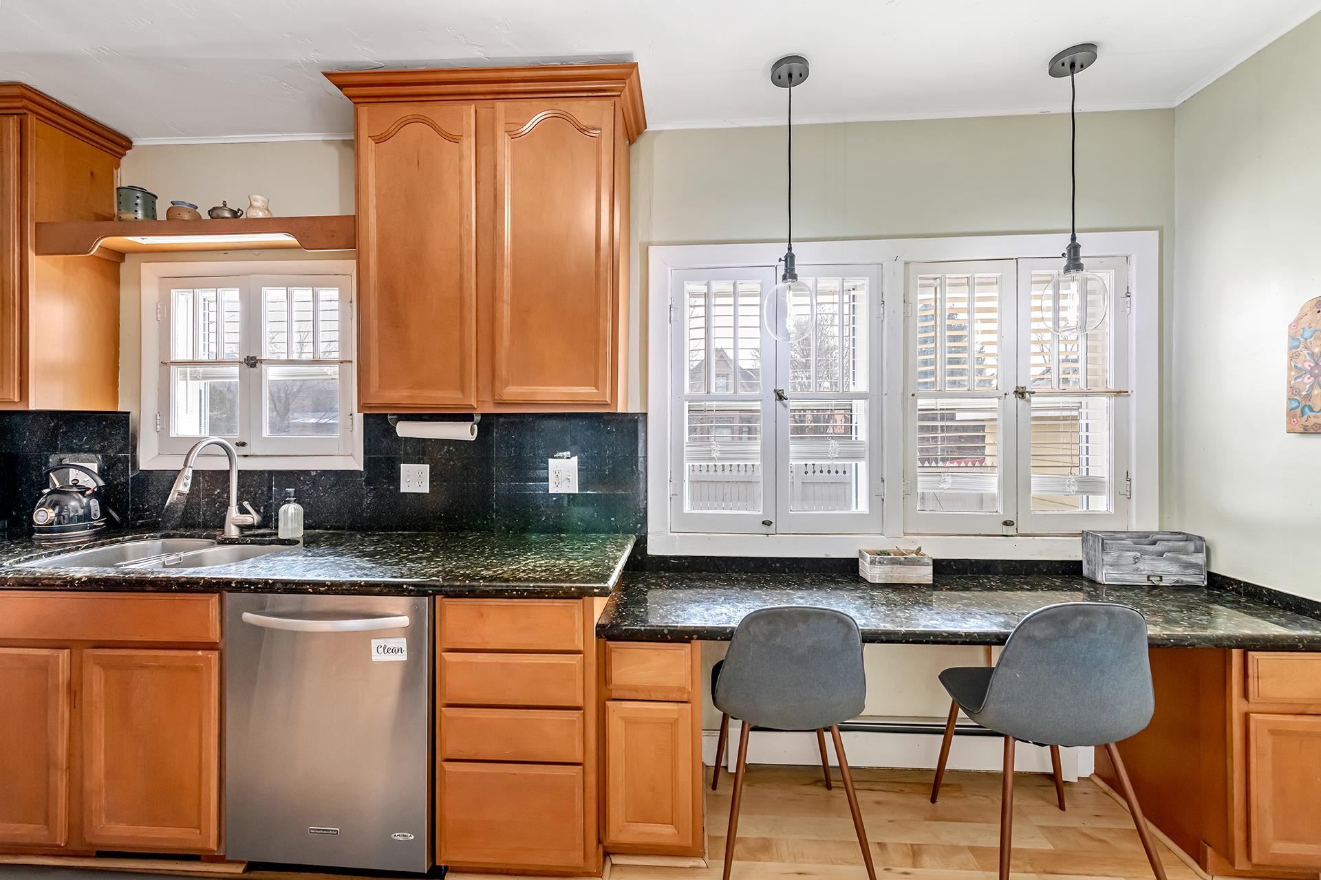 508 Main Street Palisade, CO 81526 - Photo 23 of 40 a kitchen with stainless steel appliances granite countertop a stove a sink and a granite counter tops