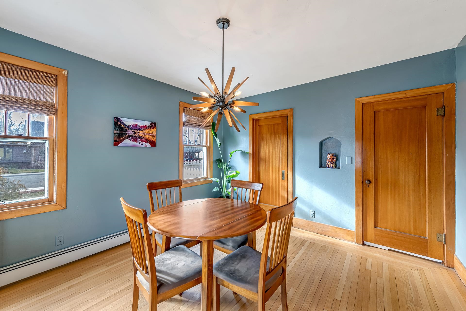 508 Main Street Palisade, CO 81526 - Photo 24 of 40 a dining room with furniture potted plants and wooden floor