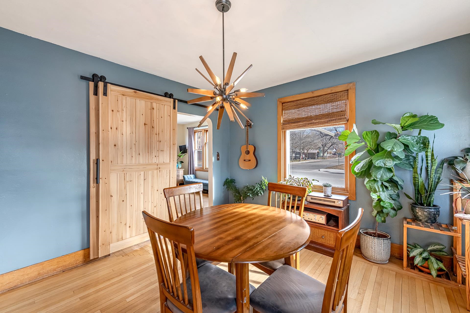 508 Main Street Palisade, CO 81526 - Photo 26 of 40 a dining room with furniture potted plants and wooden floor