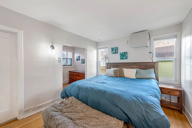 a view of an entryway with wooden floor