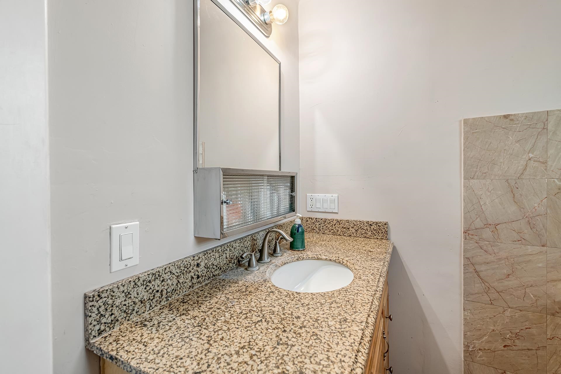508 Main Street Palisade, CO 81526 - Photo 29 of 40 a bathroom with a sink and a mirror