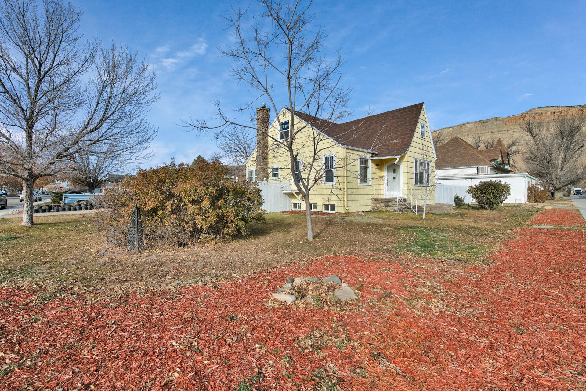 508 Main Street Palisade, CO 81526 - Photo 3 of 40 a view of a house with a yard