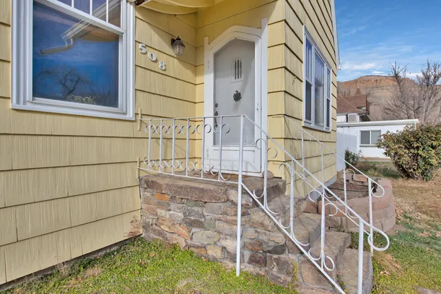 a view of a brick house with a large windows