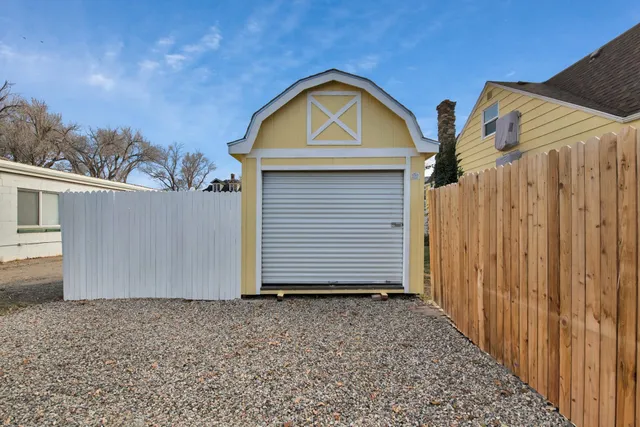a view of house with backyard