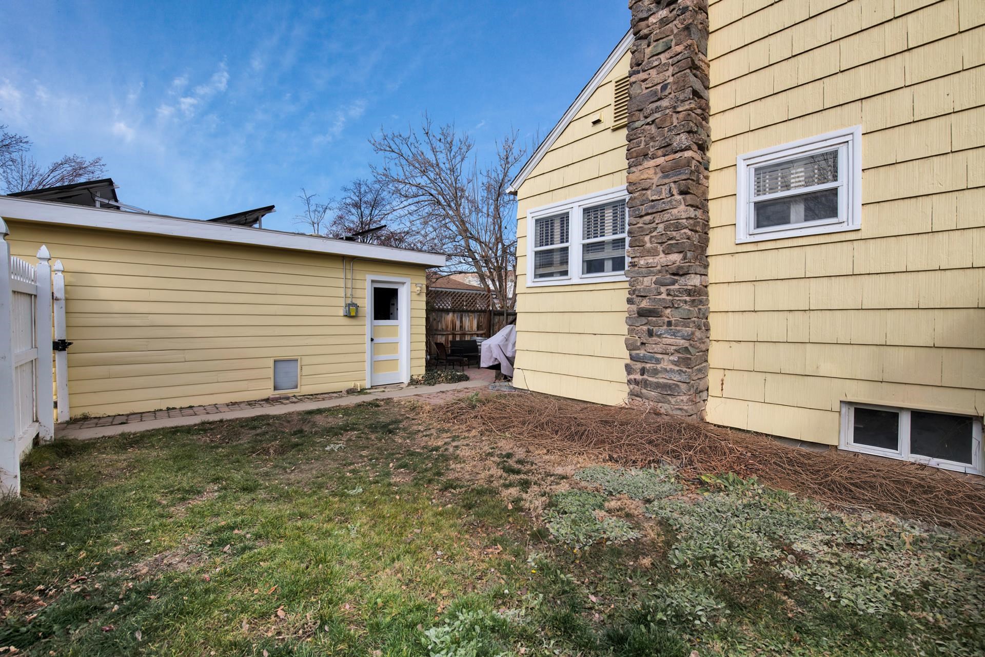 508 Main Street Palisade, CO 81526 - Photo 7 of 40 a view of a house with a backyard