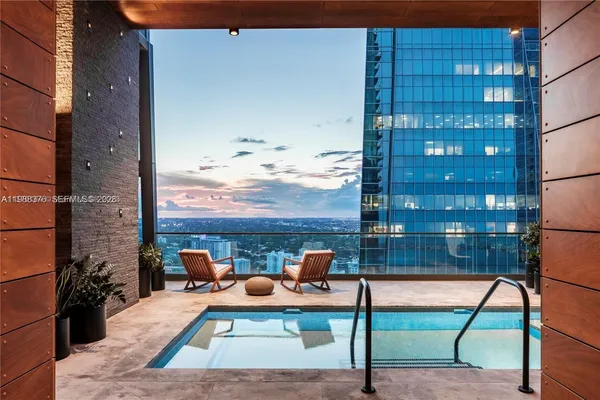 a view of balcony with furniture