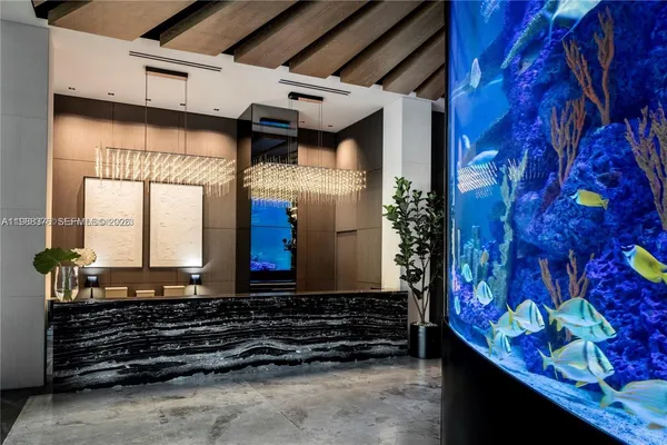 a view of a patio with table and chairs with wooden floor and fence