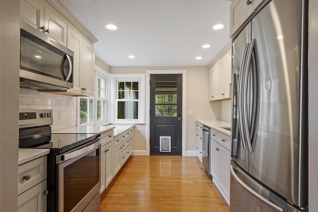 167 Gates Pond Road Berlin, MA 01503 - Photo 12 of 32 a kitchen with stainless steel appliances granite countertop a refrigerator a stove and a sink