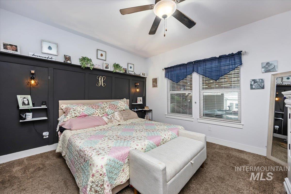 389 Arrow Street Twin Falls, ID 83301 - Photo 15 of 34 Bedroom with dark colored carpet and ceiling fan