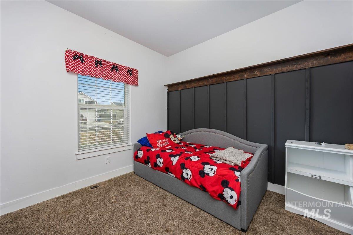 389 Arrow Street Twin Falls, ID 83301 - Photo 18 of 34 Carpeted bedroom featuring baseboards