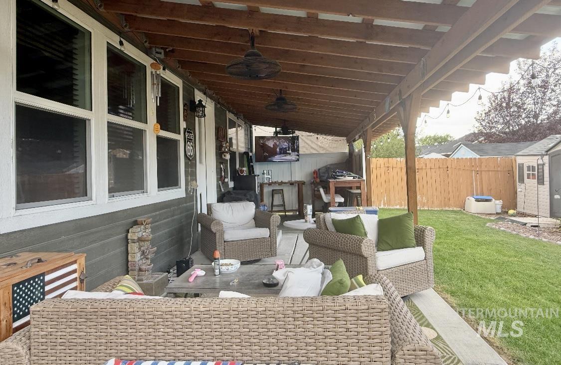 389 Arrow Street Twin Falls, ID 83301 - Photo 33 of 34 View of patio / terrace with an outdoor living space and ceiling fan