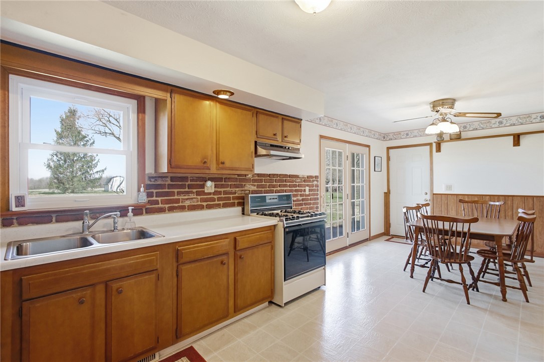 6718 Old Columbus Road South Vienna, OH 45369 - Photo 9 of 33 This spacious kitchen offers ample light and backyard access, perfect for casual dining and gatherings.