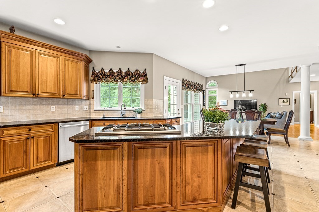 11 Pondview Lane Reading, MA 01867 - Photo 15 of 42 a kitchen with stainless steel appliances granite countertop a stove a sink and a refrigerator