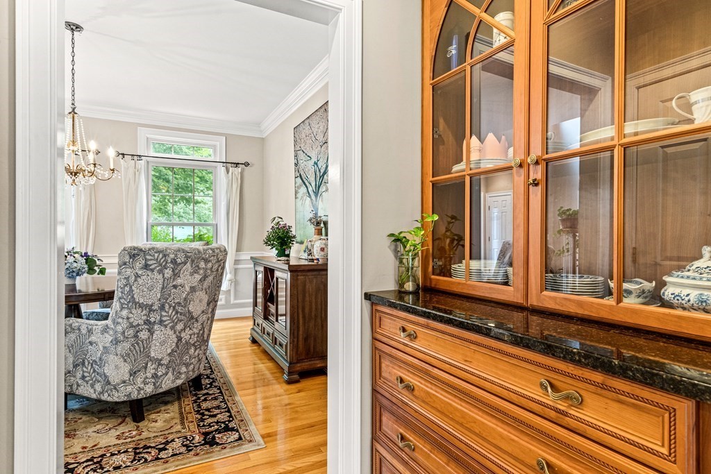 11 Pondview Lane Reading, MA 01867 - Photo 16 of 42 view of living room with furniture and floor to ceiling window