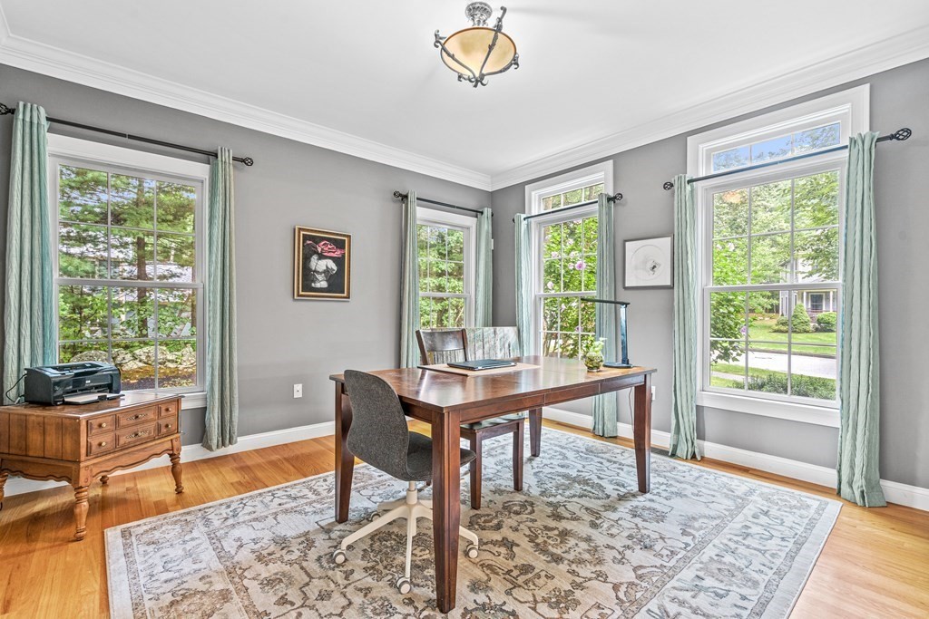 11 Pondview Lane Reading, MA 01867 - Photo 18 of 42 a view of a workspace with furniture and a window