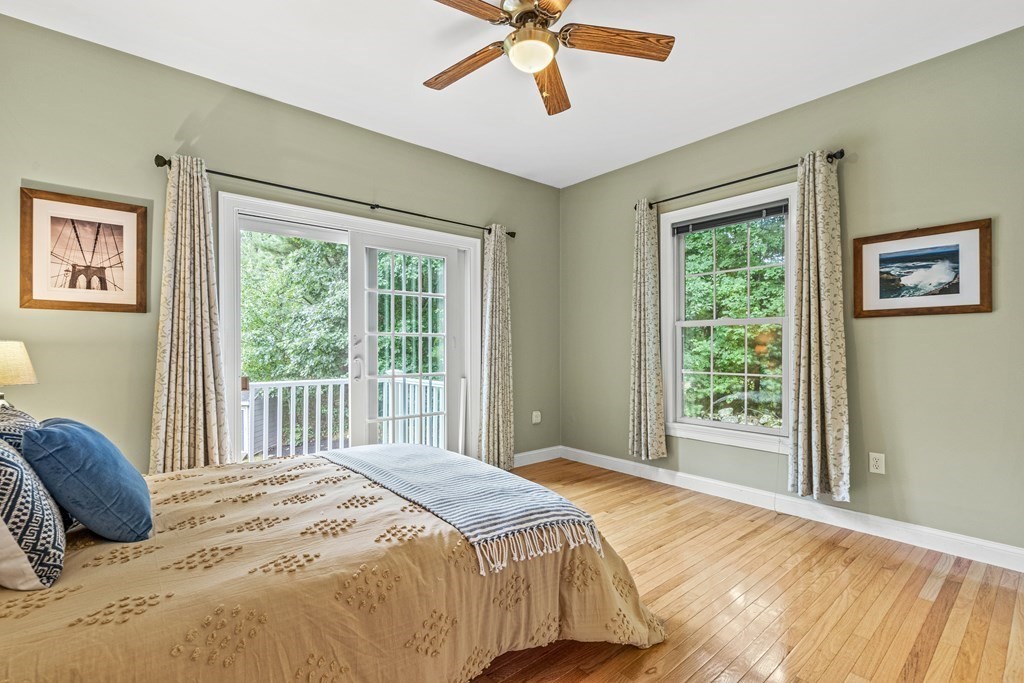 11 Pondview Lane Reading, MA 01867 - Photo 20 of 42 a bedroom with a large bed and a window