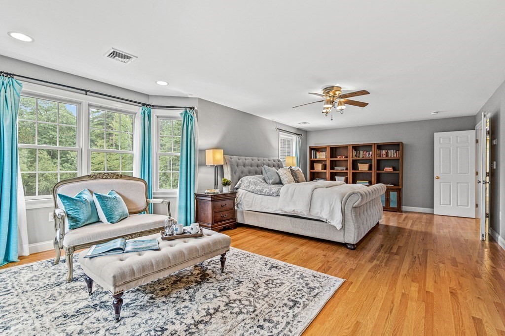 11 Pondview Lane Reading, MA 01867 - Photo 26 of 42 a living room with furniture and a wooden floor