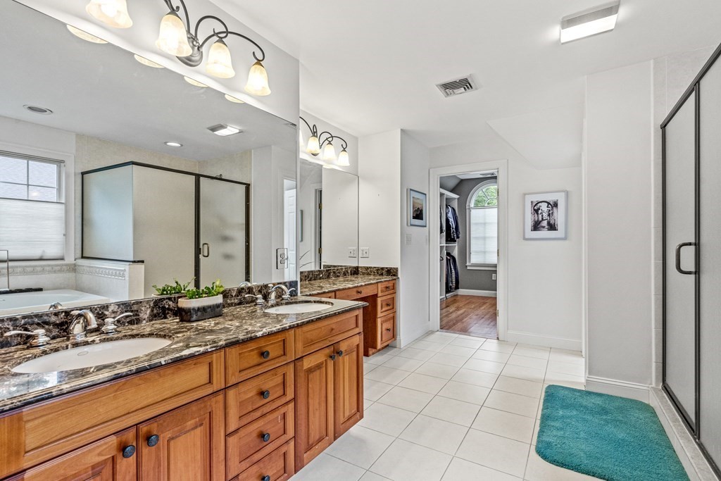 11 Pondview Lane Reading, MA 01867 - Photo 29 of 42 a large bathroom with a sink and a large mirror