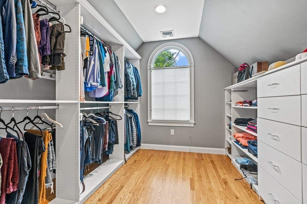 11 Pondview Lane Reading, MA 01867 - Photo 31 of 42 a view of walk in closet with clothes and shoes
