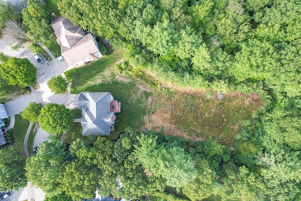 11 Pondview Lane Reading, MA 01867 - Photo 4 of 42 an aerial view of residential house with outdoor space and trees all around