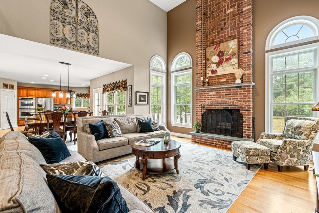 11 Pondview Lane Reading, MA 01867 - Photo 10 of 42 a living room with furniture fireplace and a fireplace