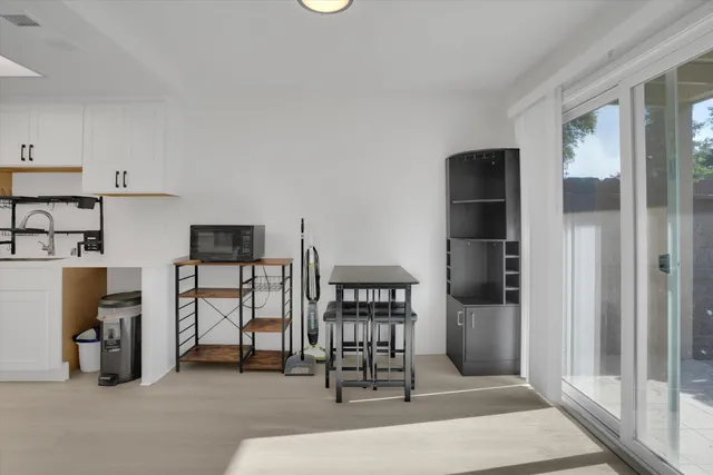 a view of a livingroom with furniture and a window