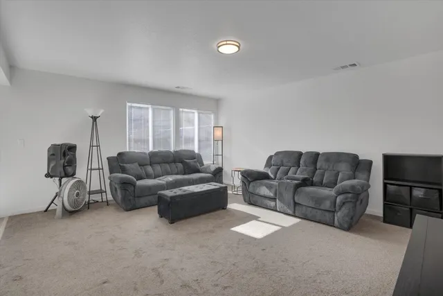 a living room with a couch and a flat screen tv