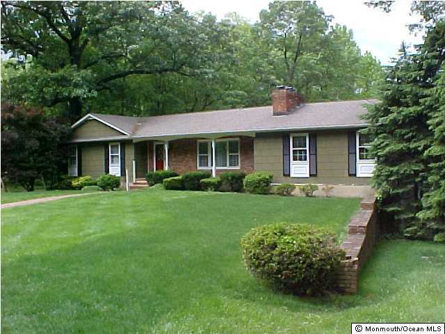 82 Baird Road Millstone Township, NJ 08535 - Photo 1 of 3 a front view of a house with a yard