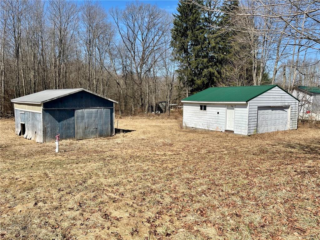 483 Hartwick Road Mercer, PA 16137 - Photo 2 of 10 a front view of a house with a yard and garage