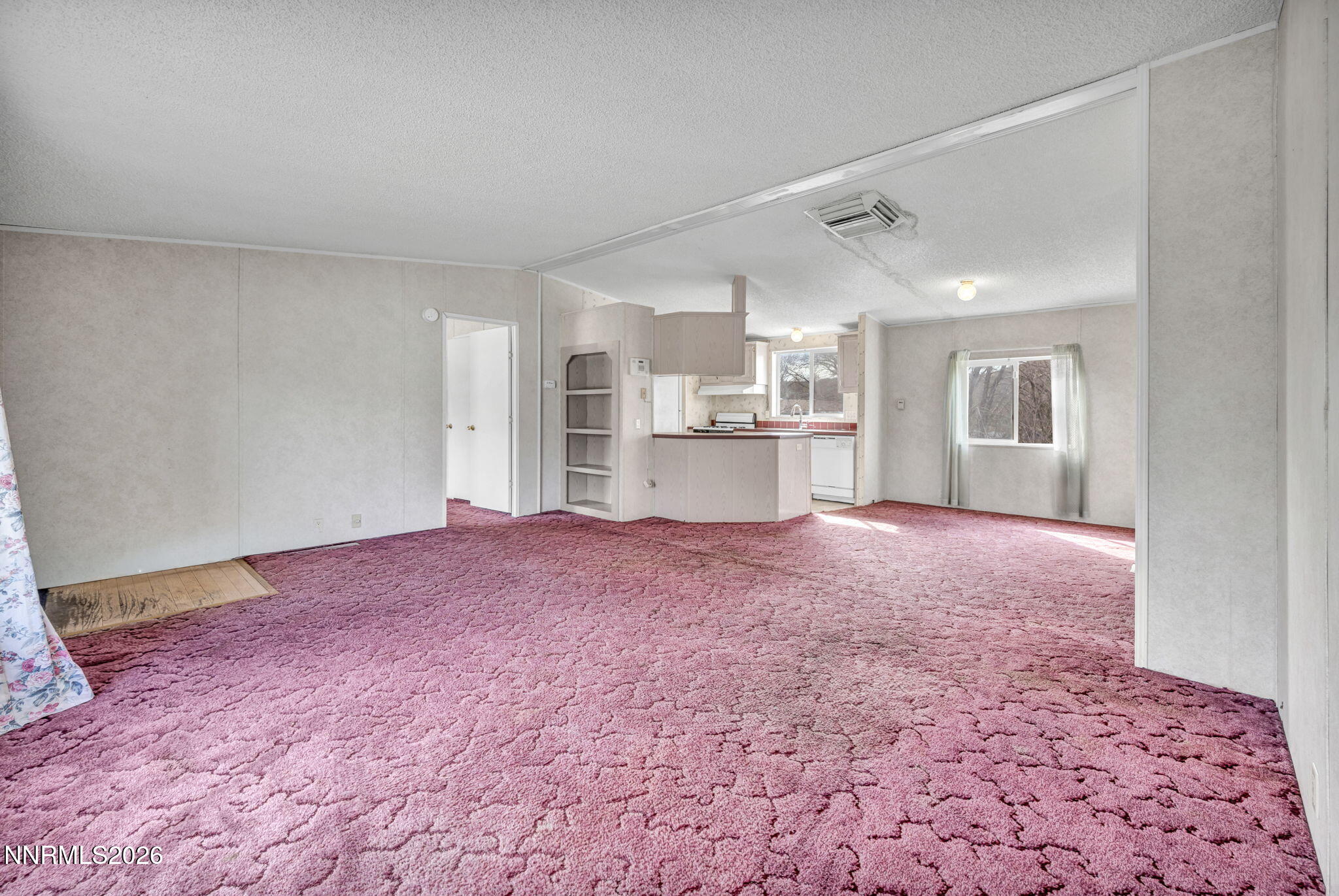 5107 Leon Drive Sun Valley, NV 89433 - Photo 13 of 43 a view of kitchen and empty room