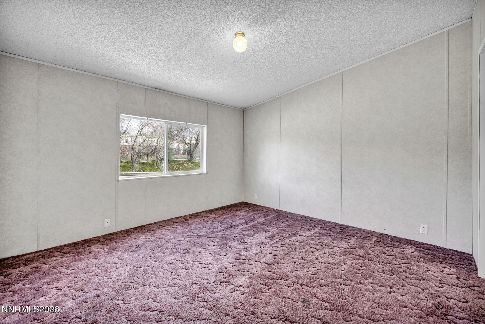 5107 Leon Drive Sun Valley, NV 89433 - Photo 15 of 43 an empty room with windows