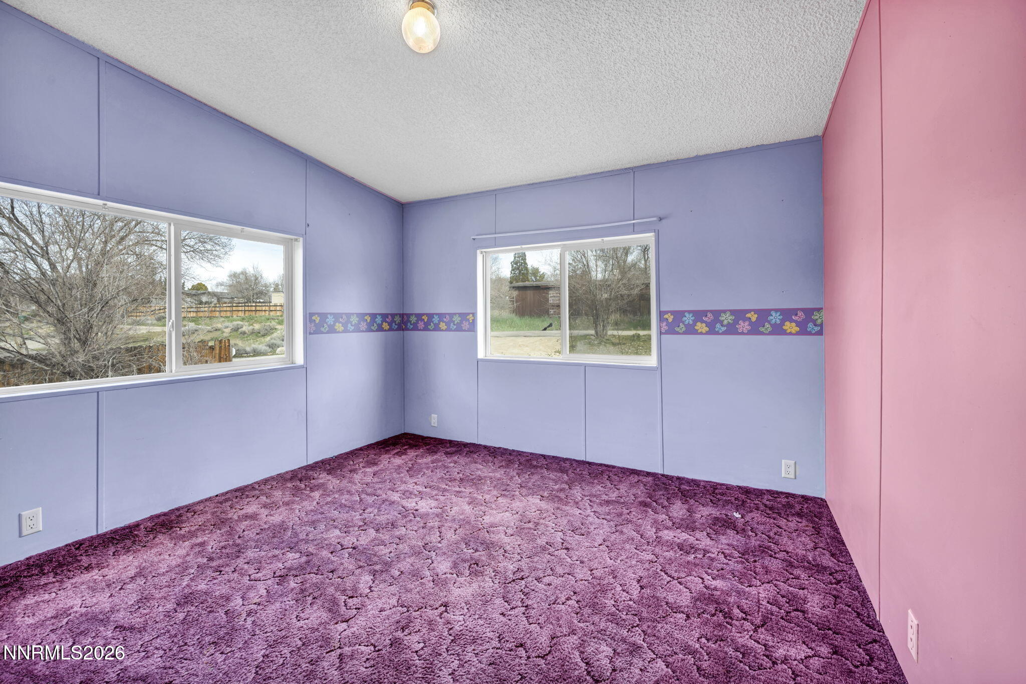 5107 Leon Drive Sun Valley, NV 89433 - Photo 21 of 43 an empty room with windows