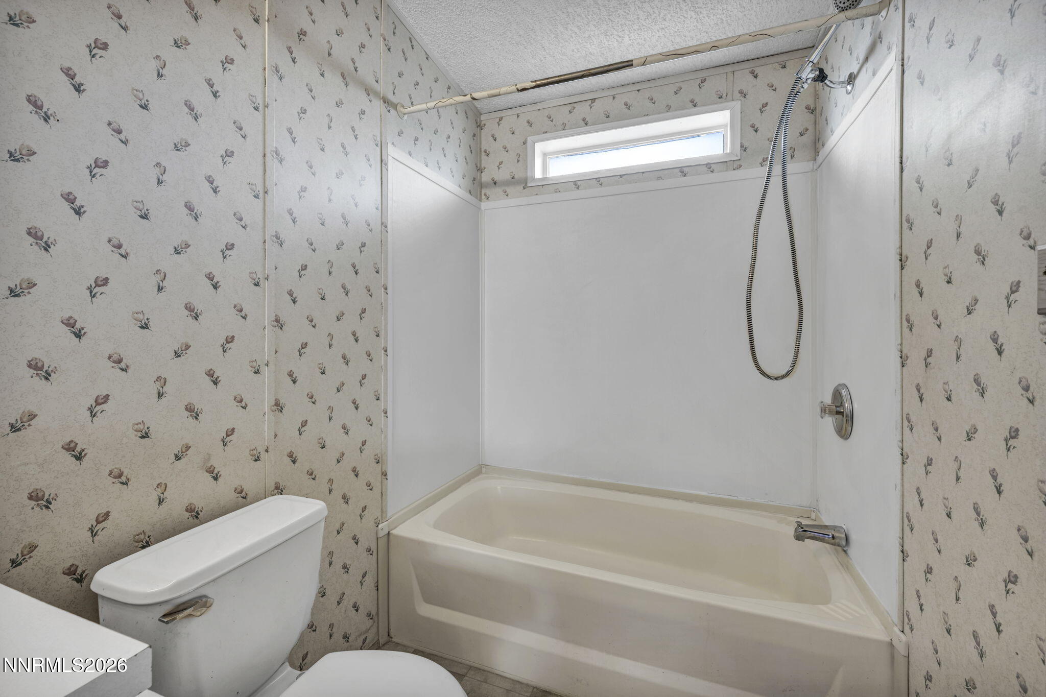 5107 Leon Drive Sun Valley, NV 89433 - Photo 26 of 43 a bathroom with a toilet and a shower